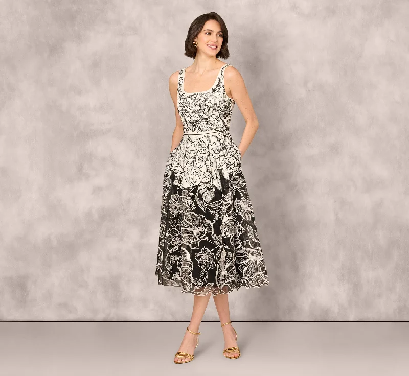 Midi dresses with side slits for a sexy and elegant appearance Sleeveless Embroidered Two Tone Midi Dress In Ivory Black Midi dresses with side slits for a sexy and elegant appearance Sleeveless Embroidered Two Tone Midi Dress In Ivory Black