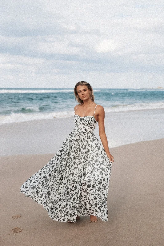 Maxi dresses with embroidered floral motifs for a unique designAchanti Pleated Maxi Dress - White Black Floral Maxi dresses with embroidered floral motifs for a unique designAchanti Pleated Maxi Dress - White Black Floral