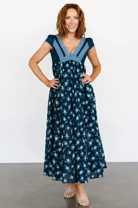 Maxi dresses with cut - out details on the sides for a modern edgeLucille Maxi Dress | Dark Blue Floral Maxi dresses with cut - out details on the sides for a modern edgeLucille Maxi Dress | Dark Blue Floral