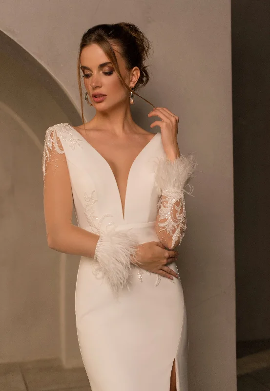 Wedding dresses with a ruched bodice for a textured lookExquisite Sheer Long Sleeve Mermaid Wedding Dress