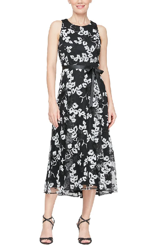 Sheer wedding guest dresses with lace inserts and long sleevesSleeveless Embroidered Stretch Tulle Dress with High/Low Hem & Tie Belt